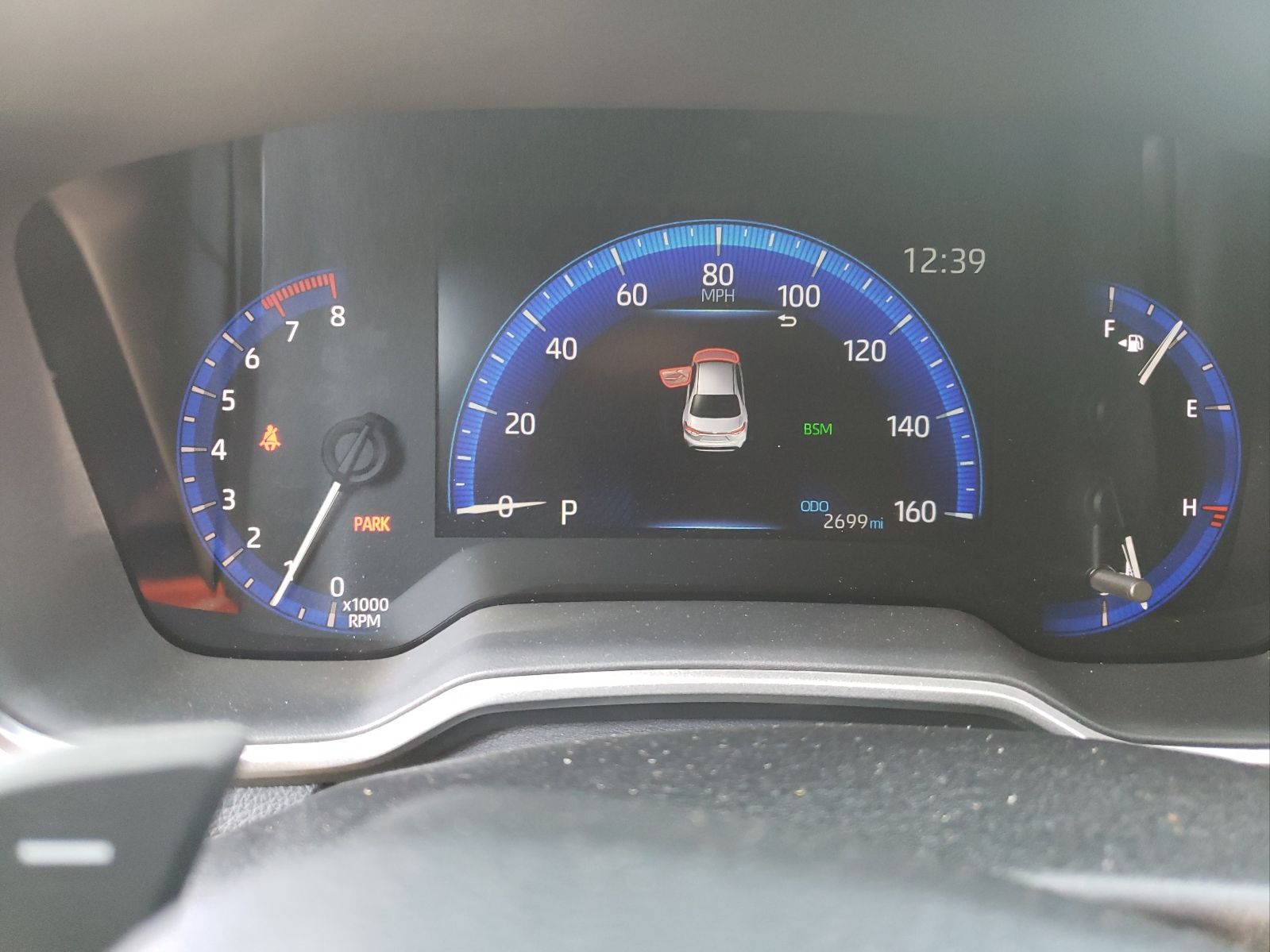 Toyota Corolla instrument cluster showing odometer reading of 2,699 miles